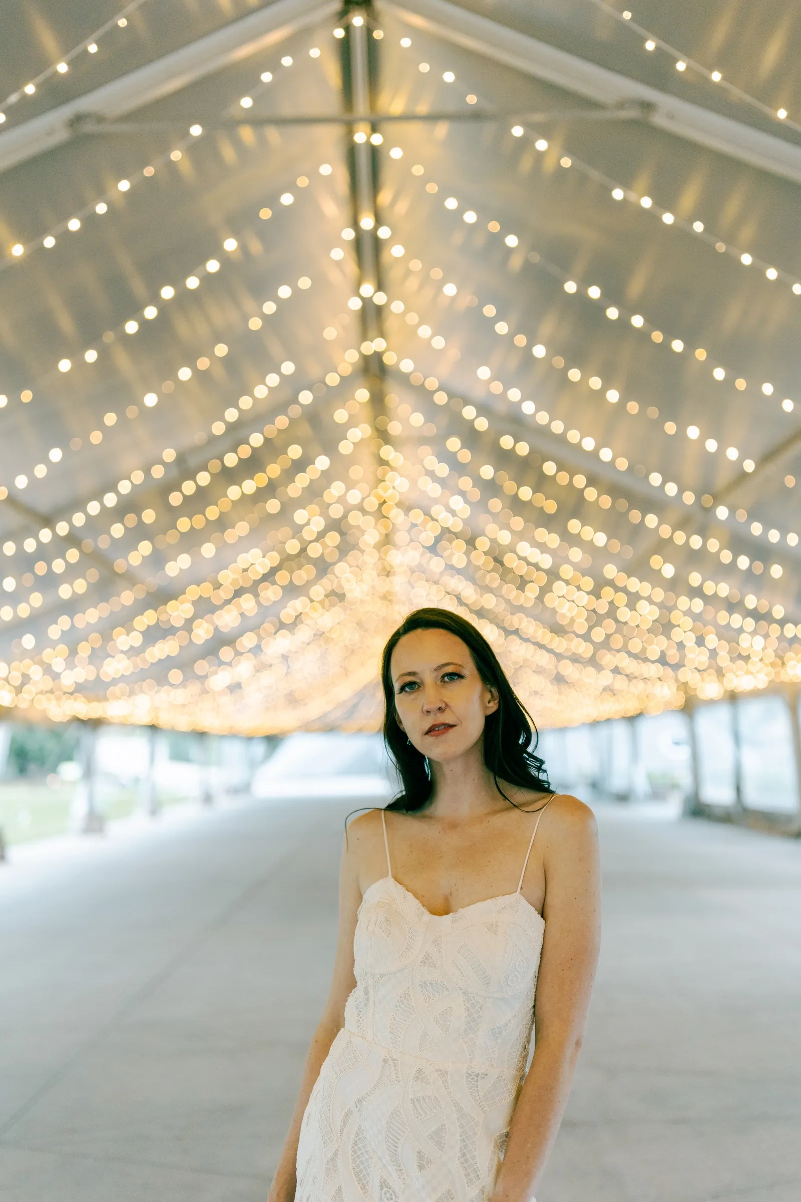Bride beneath the tent ceiling
